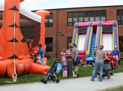 Children enjoy the moon bounce and giant slide at County Government Day on April 12. (Photo: George Clarkson)