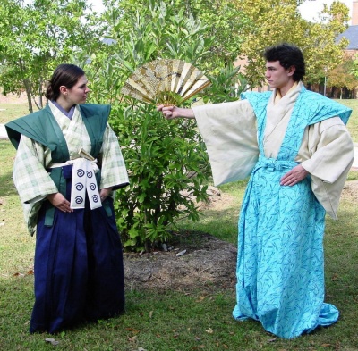 St. Mary's College of Maryland students Judy Sellner and Ian Prince act in traditional costume during Looking for Tarô Kaja, a Japanese kyôgen comedy showing at the college in late October and early November. (Photo: Barbara Woodel/SMCM)
