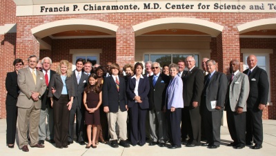 Dr. Chiaramonte (front, sixth from right) stands with the Charles County Commissioners, CSM President Bradley Gottfried, his family, and supporters in front of the building on CSM's La Plata campus that is dedicated in his honor. (Photo: George Clarkson)