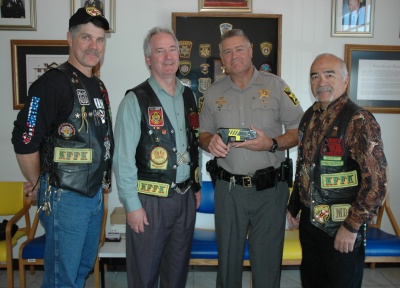 Members of the Nam Knights of America Motorcycle Club present Calvert Sheriff Evans with a $500 check which will be used to purchase a taser. Pictured left to right: Bill Collette, V.P., Mike Murphy, Treasurer, Sheriff Mike Evans, Ray Nieves, President. (Submitted photo)