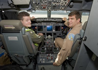 U.S. Navy pilot Lt. Roger Stanton (left) and Boeing test pilot Doug Benjamin sit in the P-8A Poseidon cockpit in preparation for flight. The aircraft’s Oct. 15 flight was the first with a Navy pilot at the controls and kicked off the formal flight test program. (Photo provided by The Boeing Company)