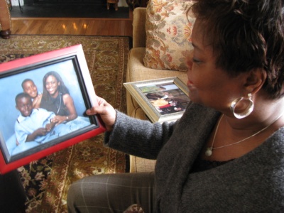 Vicki Perez shows family photographs. Her daughter, Emily Perez, was the first female West Point graduate killed in the Iraq war. (Photo: Megan Miller, CNS) 