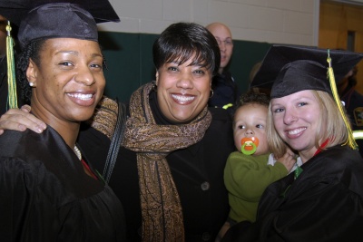 Calvert County students Tuzette Marshall of Lusby, left, and Shannon Cooper and her son Tyler of Owings, right, celebrate graduation with former CSM nursing instructor Donna Minor at CSM’s Winter Commencement Jan. 15. “He is my reason for graduating,” said Cooper of her son Tyler. (Submitted photo)