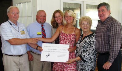 Connor Davies, fourth from left, receives her $1,000 Democratic scholarship check at a meeting of the Calvert County Democratic Women's Club on Wednesday, July 21. Left to right: Stovy Brown, Secretary, Calvert County Democratic Central Committee, Chris Davies, Connor's father and candidate for Maryland House of Delegates for District 29C, Colleen Davies, Connor's mother, Connor Davies, scholarship winner, Commissioner Barbara Stinnett, Calvert County Board of County Commissioners and President, Calvert County Women's Democratic Club, Senator Roy Dyson, Maryland State Senator for District 29. (Submitted photo) 