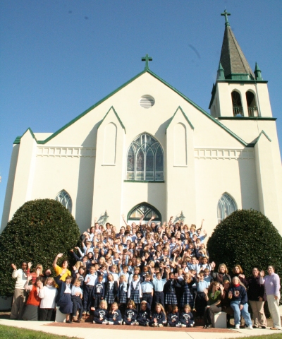Students and staff pose at the front of Our Lady Star of the Sea School in Solomons, Md. (Photo: County Times)