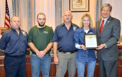 Commissioner Evan Slaughenhoupt, right, presents the Buy Local Restaurant of the Year Award to Hardesty Haven Catering. From left are Tony Hardesty, Blake Hardesty, Rick Hardesty and Dee Hardesty.