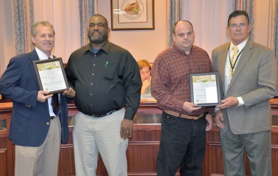 The Sustainable Meat Producer of the Year award went to two local providers. From left are Commissioner Steve Weems, Dale Jones of Windy Willow Farm, Chris Dowell of Crooked Branch Farm and Commissioner Pat Nutter.