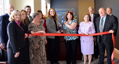 Calvert County Administrator Terry Shannon (front left) and county commissioners welcome CSE President Donna Croll (center left) and Vice President Tamara Myers (center right) and staff to their Prince Frederick location.