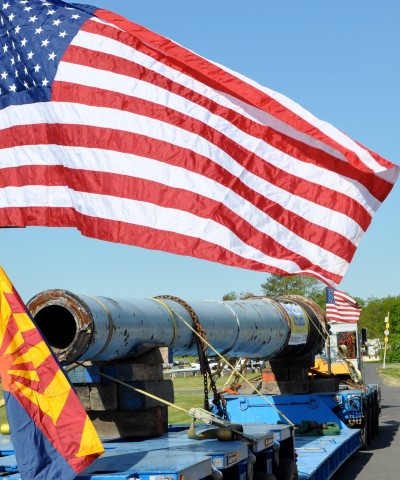 The last USS Arizona 14-inch gun barrel begins its move from the Naval Surface Warfare Center Dahlgren Division in Virginia to Phoenix, Ariz., April 10. The gun barrel—removed from the USS Arizona to be relined before World War II—was at the Dahlgren Naval Proving Ground for proof testing when the attack on Pearl Harbor occurred on Dec. 7, 1941. The state of Arizona is also moving a USS Missouri gun barrel from Norfolk Naval Shipyard's St. Julien's Creek Annex to exhibit with the Arizona gun. These two barrels, representing "bookends" of World War II—the beginning and end—will significantly enhance the USS Arizona memorial exhibit at the Arizona Capitol Museum in Phoenix. (U.S. Navy photo by John J. Joyce/Released)