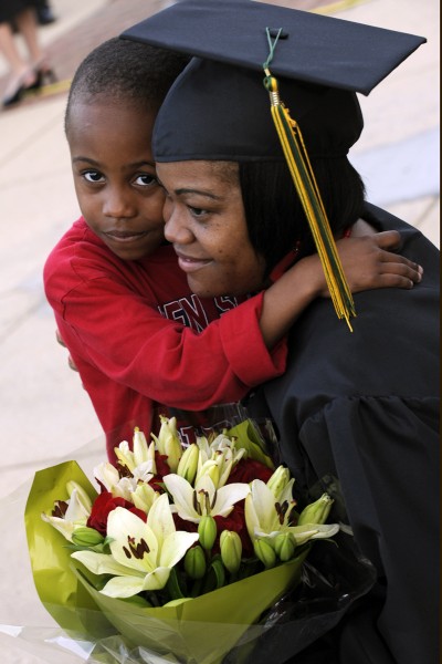 Nyema Taylor, of Waldorf, gets a congratulatory hug from her son, Shamir Taylor Jr., 5, following CSM's 53rd Spring Commencement May 10. (Photo: CSM)