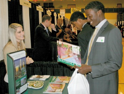 Westlake High School senior Xavier Maloy, right, talks with a representative from the University of North Carolina at the Charles County College Fair Sept. 19. (Submitted photo)