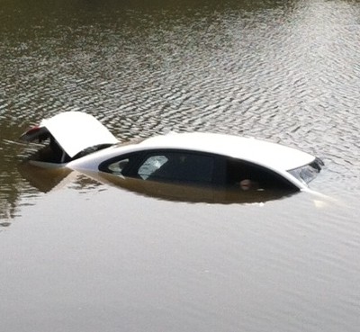 This Hyundai ended up in Wakefield Lake this afternoon after the driver lost control of the car because she was texting instead of paying attention to her driving. (Photo: Charles Co. Sheriff's Office)