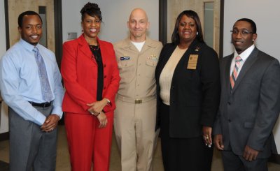 The Naval Surface Warfare Center Dahlgren Division (NSWCDD) commander and employees are pictured during the African American/Black History Month celebration held at the University of Mary Washington Dahlgren campus Feb. 19. Standing left to right are: NSWCDD Black Employment Program Manager Michael Hobson; NSWCDD Disability Program Manager and Special Emphasis Program Coordinator Marcella Bushrod; NSWCDD Commander Capt. Brian Durant; NSWCDD Blacks in Government Chapter President Elma Williams-Coleman; and National Society of Black Engineers Potomac River Alumni Chapter President Dwayne Nelson. (U.S. Navy photo by Jimmy Waits/Released)