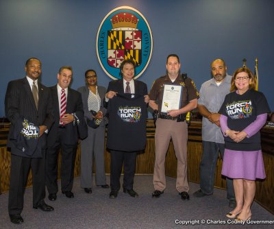 Commissioners present the 2014 Law Enforcement Torch Run proclamation to the Charles County Sheriff’s Office. Pictured, left to right: Commissioner Vice President Reuben B. Collins, II (District 3); Commissioner Bobby Rucci (District 4); Commissioner Debra M. Davis, Esq. (District 2); Commissioner Ken Robinson (District 1); Sgt. Chris Schmidt (Charles County Sheriff’s Office); Sgt. Agustus Proctor, Jr. (Charles County Sheriff’s Office); Commissioner President Candice Quinn Kelly.