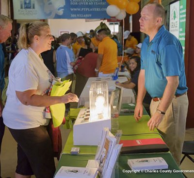 A representative from Southern Maryland Electric Cooperative, a participating sponsor, talked with a citizen about how to make your home more energy efficient and cut electricity costs.