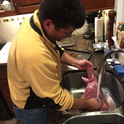 Peter Oristian of Rockville washes a large piece of venison on Dec. 1. Photo courtesy of Peter Oristian.