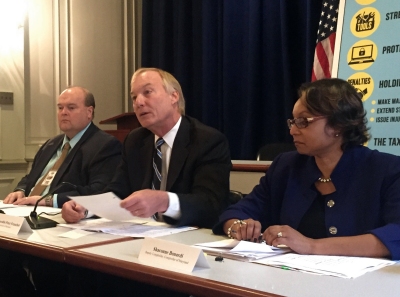 From left to right, Jeffrey Kelly, director of the Field Enforcement Division for the Comptroller of Maryland, Comptroller Peter Franchot and Deputy Comptroller Sharonne Bonardi announced the proposal of the Taxpayer Protection Act on Dec. 1, in Annapolis. (Photo: Naomi Eide).