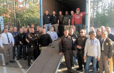 CCSO employees load donated goods into a truck in assistance to the Children's Aid Society. A full size photo is available here. (Photo courtesy CCSO)