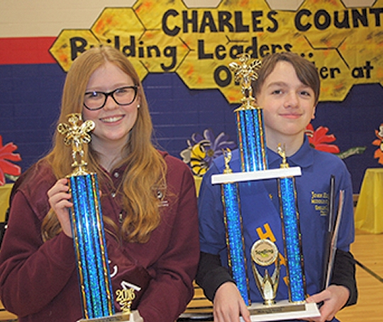 Charles County Public Schools held its 38th annual Spelling Bee Feb. 19 at Benjamin Stoddert Middle School. John Hanson Middle School eighth grader Nicholas Gallegos, right, was named the overall top speller and advances to the national level in May. Holli Kobialka, an eighth grader at Southern Maryland Christian Academy, left, earned second place overall. Gallegos spelled the word "azimuth" correctly to win the top spot.