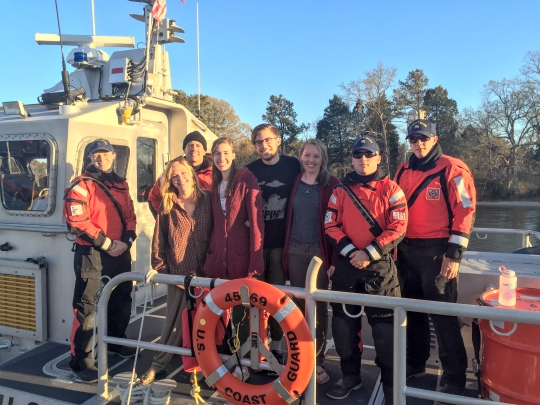 From left to right: Petty Officer 3rd Class Sarah Peterson, Petty Officer 2nd Class Gary Kovack, Seaman Apprentice Bry Huebel, and Seaman Thomas Magness pose with the rescued boater and the other three boaters who had gone overboard Tuesday March 29, 2016, while boating in Tanner Creek, near Point Lookout State Park, Md. Coast Guard watchstanders received a report of two people aboard a kayak and two people aboard a paddleboat beset by weather, but needed to rescue only one by the time they arrived on scene. U.S. Coast Guard photo by Petty Officer 3rd Class Christopher Vincent.