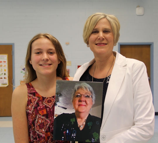 Kristin Shields, right, principal of Mt. Hope/Nanjemoy Elementary School, was named the 2016 National Distinguished Principal for Maryland. She is pictured with her daughter Haley, 13, and while Shields' mother Peggy Kelly, couldn't come to the ceremony, the family made sure her face was in the crowd.