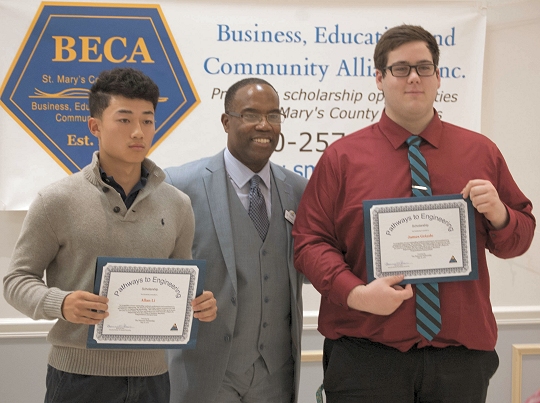Dr. Tracy Harris, Vice President and Dean, CSM Leonardtown Campus, TPP Board of Directors, presents Allan Li and James Grizzle with scholarship certificates for the Pathways to Engineering program.