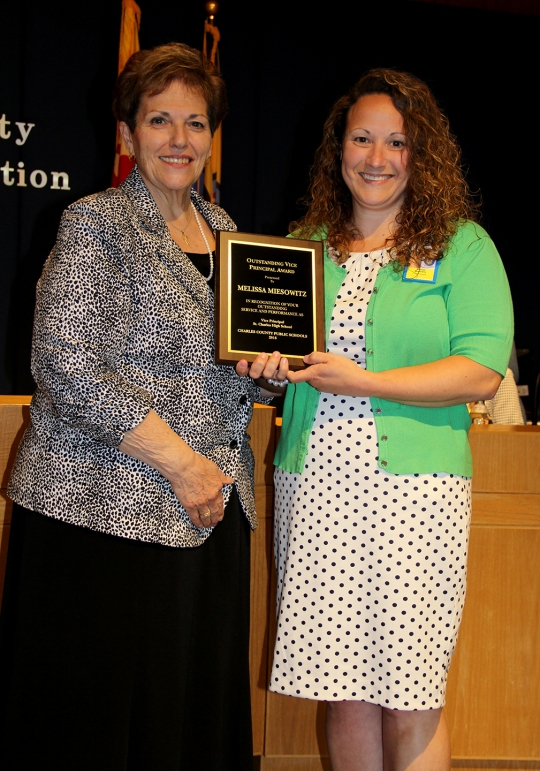 Board of Education Chairman Virginia McGraw, left, honored St. Charles High School Vice Principal Melissa Miesowitz, right, with the 2016 Charles County Public Schools Vice Principal of the Year award at the Board's June 14 meeting. Each year, Charles County Public Schools honors one outstanding vice principal with the award.