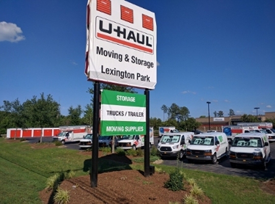 U-Haul signage and rental equipment along the Great Mills Road frontage.