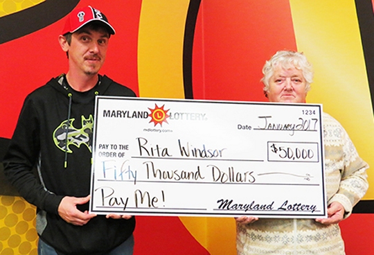 Rita Windsor of Hughesville and her son Wayne collected the first $50,000 top prize on the Pay Me! scratch-off. (Photo courtesy Md. Lottery)
