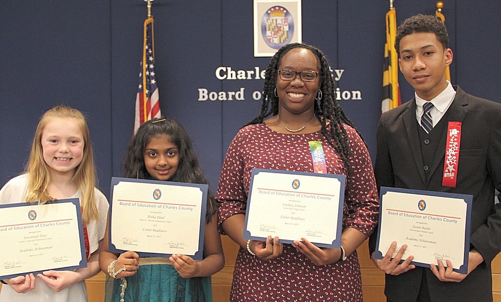 Four students were honored for their accomplishments at the March 21 meeting of the Charles County Board of Education. Pictured from the left are Savannah Trice, a fifth grader at Walter J. Mitchell Elementary School; Astha Patel, a fifth-grade student at Mary H. Matula Elementary School; Lindsay Johnson, a senior at North Point High School; and Justin Butler, an eighth grader at Mattawoman Middle School.
