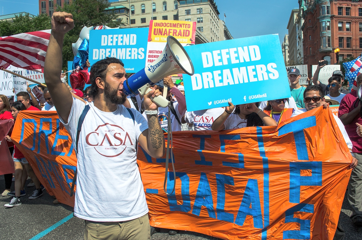 Marchers head down 15th Street NW to show their support for DACA and TPS after the decision was released. (Photo by Helen Parshall)
