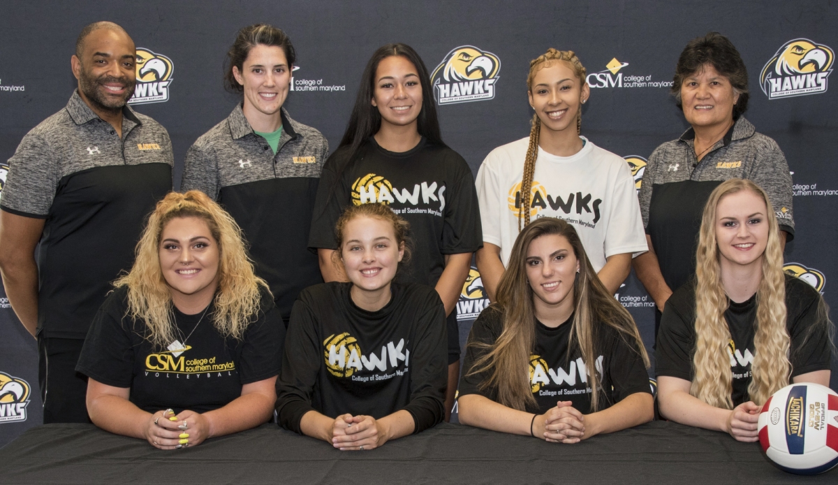 Newly signed Hawks volleyball players are, front row from left, Savannah Carroll, Alexis Lauer, Peyton Boelke and Alexandra Allen and, back row, next to Assistant Coach Ron Swann and Head Coach Ashley Wolfe, Reagan Tuiasosopo and Aliyah Jackson with Recruiting/Assistant Coach Nila Straka.