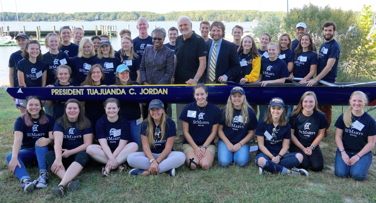 Students and staff pose with the new rowing shell at St. Mary's College of Maryland. (Photo: SMCM)