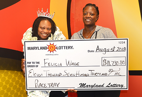 Felicia Wade of Waldorf, left, won $11,730.80. Her sister Tamara also appears
