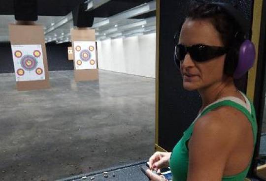 Amy Cunning of Hollywood loads up at Flat Broke Shooters new indoor range. (Photo: The County Times)