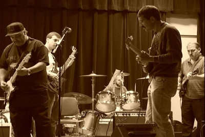 Garry Simmons, Pete McDevitt, Bob Schaller, Jeff Bast perform on stage for their Art of Jamming Guitar Class Recital in Leonardtown on Sat. Dec. 2, 2006.