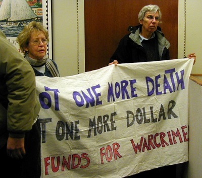 Mary Parker of Mt. Rainier and Susan Crane of Baltimore hold a sign in Sen. Mikulski's office protesting additional funds for the war in Iraq. Photos by Hallie C. Falquet.