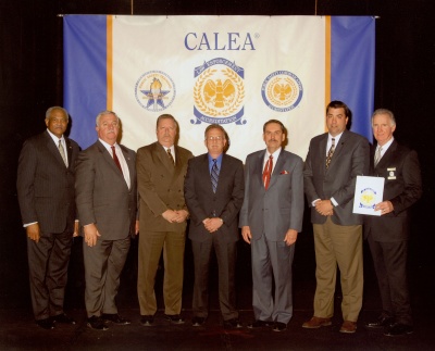 Celebrating the Charles County Sheriff’s Office’s CALEA Re-Accreditation are, from left to right, CALEA Executive Director Sylvester Daughtry Jr., Charles County Commissioner Sam Graves, Capt. Robert Cleaveland, Major Joe Montminy, Lou Schmidt, Major Buddy Gibson and Commission Chair James O’Dell.