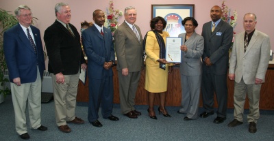 Pictured with the Commissioners are Gwen Smith, Aaron Taylor, and Jim Smith of the Housing Program, Department of Community Services, Charles County Government. (Photo: George Clarkson)