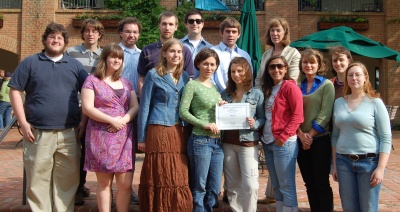 St. Mary's College of Maryland President Jane Margaret O'Brien (second row, right) joins editors of the college's newspaper to celebrate its being named "Best College Newspaper for 2007-2008" by the American Scholastic Press Association. Pictured with O'Brien are (front row, from left) Laura Cooper, arts and entertainment editor; Lara Southgate, assistant style editor; Julia Copley, managing editor; Meredith Queen, co-news editor; Lisa Harmon, co-sports editor; Katie McLaughlin, co-news editor; Melanie Zuckerman, assistant editor-in-chief; and Grace Livingstone, layout editor. In the back row (from left) are Kyle Jernigan, assistant opinions editor; Rowan Copley, co-photo editor; Dan Pindell, back page/humor editor; Ryan Hunt, opinions editor; Justin Perry, style editor; and Eric Schlein, editor-in-chief. Not pictured are Mariel Saez, co-sports editor and Matt Molek, co-photo editor.