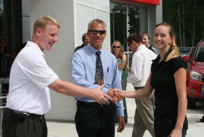 Toyota of Southern Maryland representatives Will Ryan (left) and Gene Cartwrite congratulate St. Mary's College of Maryland student Jocelyn Henderson on winning a Toyota in the "Starving Student" contest. (Submitted photo)