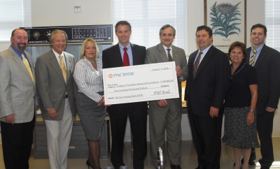 Celebrating PNC’s $100,000 Tech-Challenge Match Program with the College of Southern Maryland Foundation are, from left, CSM’s Foundation Chair Don Parsons, Chair of CSM’s “Campaign for the Next 50 Years” Michael A. Besche, CSM Development Department Director Jane Loughran, PNC Regional President Scot Ebron, CSM President Dr. Bradley Gottfried, PNC Senior Vice President Business Advisor Brian Bucci, PNC Public Relations Market Manager Jan Lomax and PNC Vice President Business Banking Sales Manager Brian Compton.