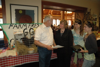 John Dalton, of Daltons Orchard and Apiaries; St. Marys College of Maryland dean of students Laura Bayless; and Master of Arts in Teaching student Rachel Clement08 and Katie Mazzocco10 discuss chickens from his farm behind him and the fresh eggs he provides the college every day. (Submitted photo)