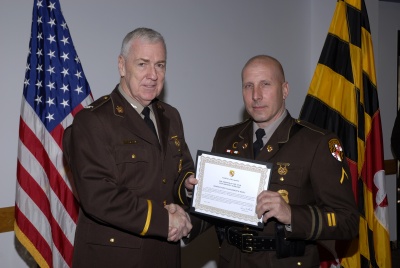 Superintendent Colonel Terrence B. Sheridan presents the Maryland State Police 2008 “Trooper of the Year” award to TFC Robert B. Rezza, of the Leonardtown Barracks. (Submitted photo)