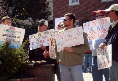 Watermen stand outside the State House in Annapolis Tuesday urging legislators to pass bills that would diminish the Department of Natural Resources' authority to regulate oyster harvesting. Watermen say they believe Gov. Martin O'Malley's proposed Oyster Restoration and Aquaculture Development Plan will put them out of business. (Capital News Service Photo by Jennifer Hlad)