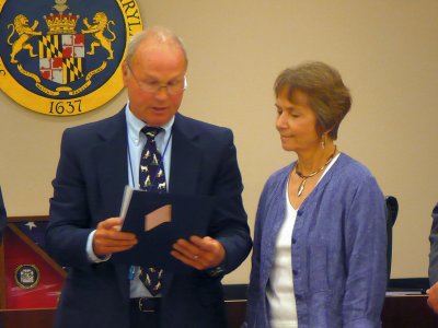 Jack Russell, president of the St. Mary's County Board of Commissioners, presents Merideth Taylor, professor of theater and dance at St. Mary’s College of Maryland, with a Historic Preservation Service Award for her documentary film, “With All Deliberate Speed: One High School’s Story.” The film is about the desegregation of Great Mills High School. The Historic Preservation Award is given to those who demonstrate outstanding achievement in and support for furthering the aims of historic preservation in St. Mary’s County. (Submitted photo)