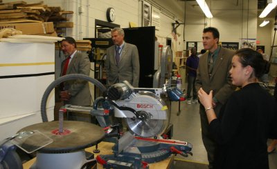 Elliot Pulham, the chief executive officer of the National Space Foundation, pictured left, participates in a biochemistry lab with North Point High School seniors Blaire Cope­land, center, and Bianca Varela, right, during his tour of the school with Principal Kim Hill on Tuesday, Oct. 12. (Submitted photo)