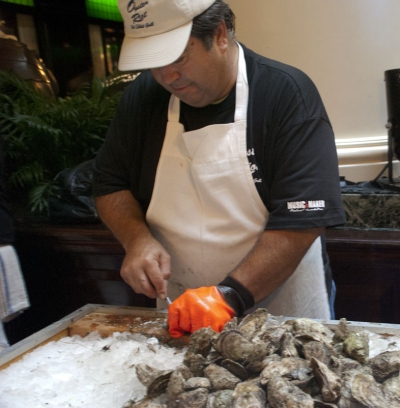 Oyster shucker Wayne Copsey of Mechanicsville has been coming to the Oyster Riot every year since it began. He said he was the U.S. National Oyster Shucking champion in 1982 and 1989. The Oyster Riot this year donated a portion of its proceeds to the Oyster Shell Recycling Alliance. The alliance collects oyster shells from area restaurants and recycles them back into the bay. (Capital News Service Photo by Nicole Dao)