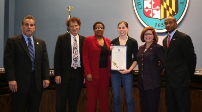 Jena Hatfield is recognized by the Board of Commissioners for helping to save the life of a vehicle accident victim last November. (Submitted photo)