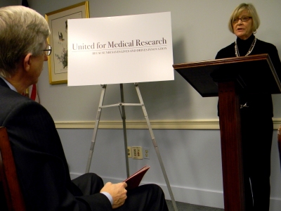 George Ann Blough, standing, an ovarian cancer survivor and volunteer for the American Cancer Society Cancer Action Network, shares her story at a news conference on Capitol Hill. Blough urged additional congressional funding for biomedical research. (Photo: Capital News Service's Jessica Harper)